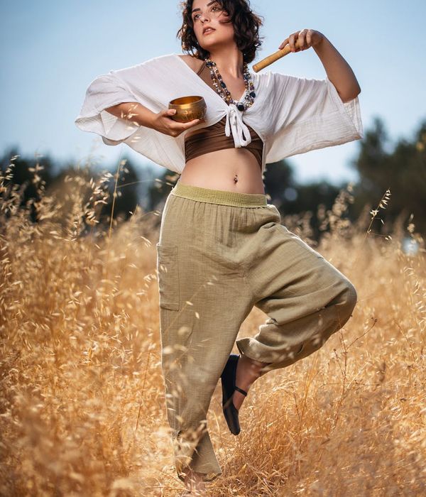 Woman performing a serene yoga pose in a calm environment.